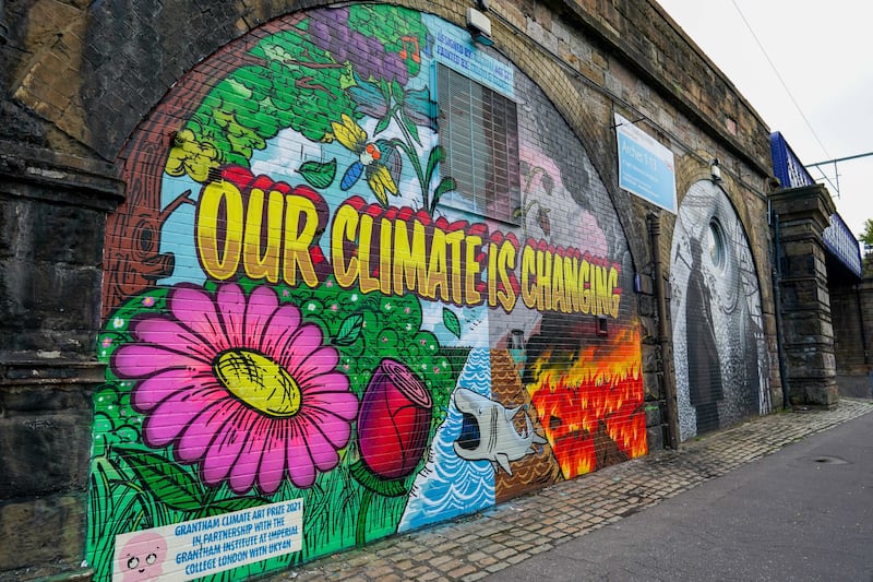 A climate change mural in Glasgow. Current understanding of tipping points, in which the climate system exceeds a threshold beyond which large and often irreversible changes occur, is limited. Bloomberg