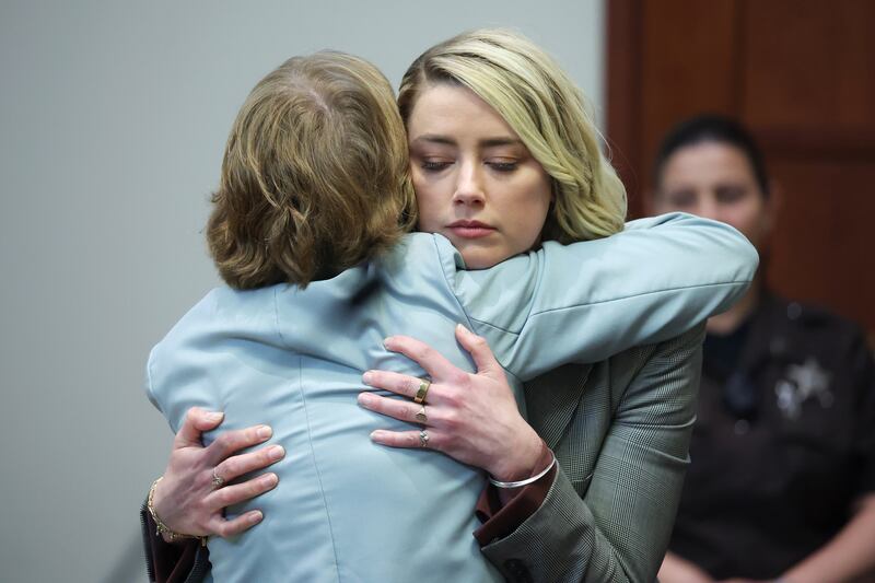 Heard hugged her attorney Elaine Bredehoft after she testified one last time. EPA