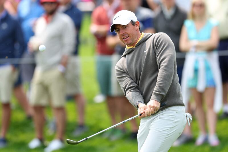 Rory McIlroy chips to the 11th green during a practice round prior to the 2023 PGA Championship at Oak Hill Country Club. Getty
