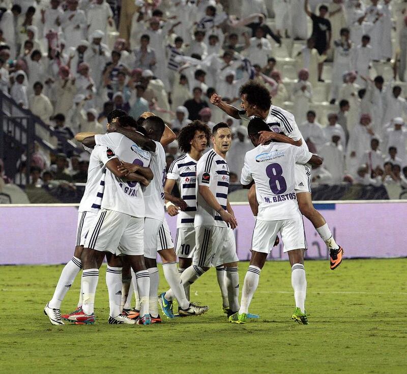 Al Ain players celebrate after clinching three points from the brink of a draw at home against Al Nasr.  Jeffrey E Biteng / The National