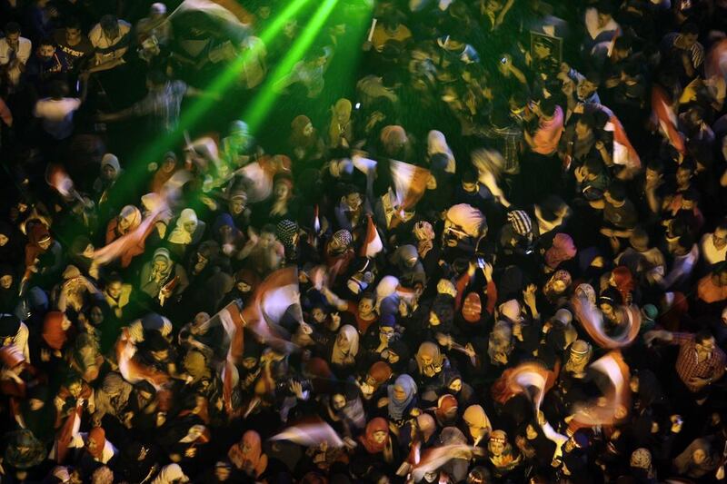 Supporters of Abdel-Fattah el-Sissi, the nation’s former military chief, wave national flags during a celebrations at Tahrir Square in Cairo, Egypt. Amr Nabil / AP Photo