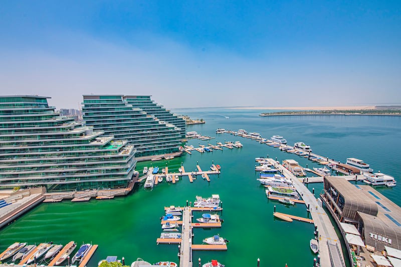 Towers in the Al Bandar development stretch out into the water with boats parked up in the surrounding marina, giving it vibes of the South of France