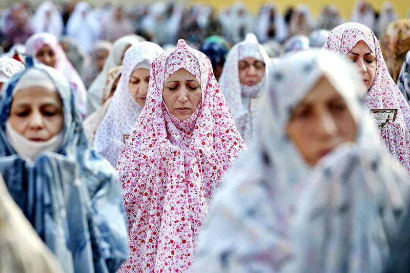 Iranian women pray during the Eid Al Fitr prayer in Tehran, Iran. Eid al-Fitr marks the end of the holy month of Ramadan, during which Muslims all over the world fast from sunrise to sunset. Ebrahim Noroozi / AP photo
