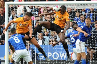 Wolverhampton Wanderers' Leander Dendoncker, top left, scores a goal that was disallowed during the English Premier League soccer match between Leicester City and Wolverhampton Wanderers at the King Power Stadium in Leicester, England, Sunday, Aug.11, 2019. (AP Photo/Rui Vieira)