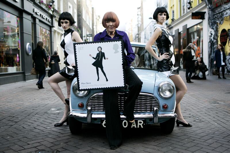 In 2009, Mary Quant, centre, poses with models in Carnaby Street, London. AP
