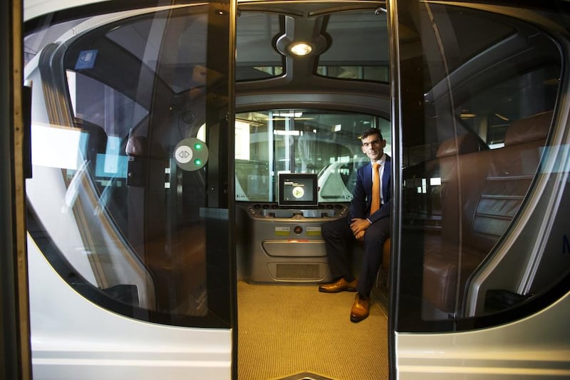 Karim Karam, professor of engineering systems management, sits in a driverless vehicle at the Masdar Institute in Abu Dhabi. Christopher Pike / The National