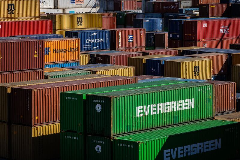 Shipping containers sit stacked on the dockside at the Port of Leixoes commercial shipping port in Porto, Portugal, on Thursday, July 2, 2020. The European Union said its trade with the rest of the world would slump this year by as much as 868 billion euros ($963 billion), or more than 10%, in a gloomier updated forecast that offers fresh evidence of the global economic damage caused by the coronavirus. Photographer: Eduardo Leal/Bloomberg