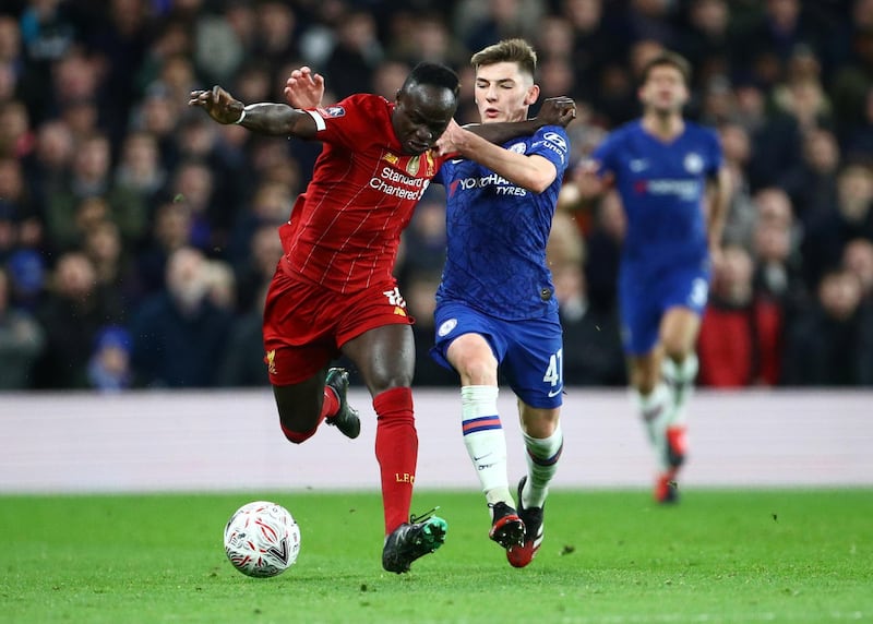 Billy Gilmour challenges Liverpool forward Sadio Mane for the ball. Reuters