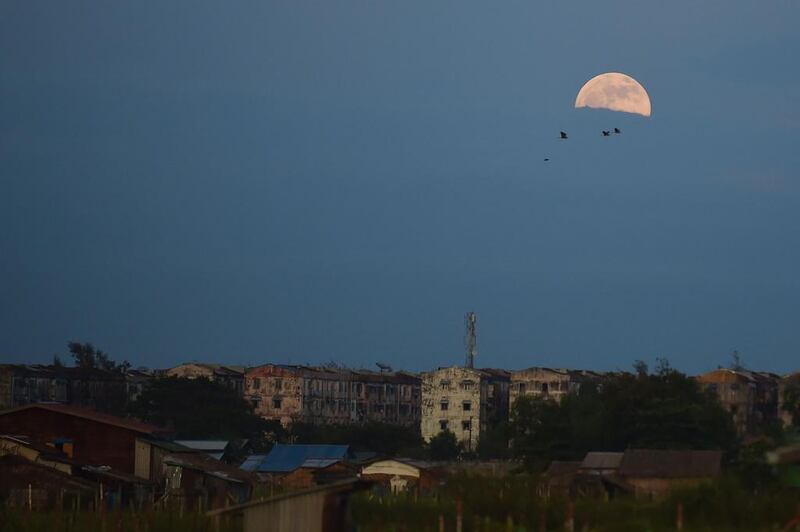 The full moon is seen from Yangon. Ye Aung Thu / AFP
