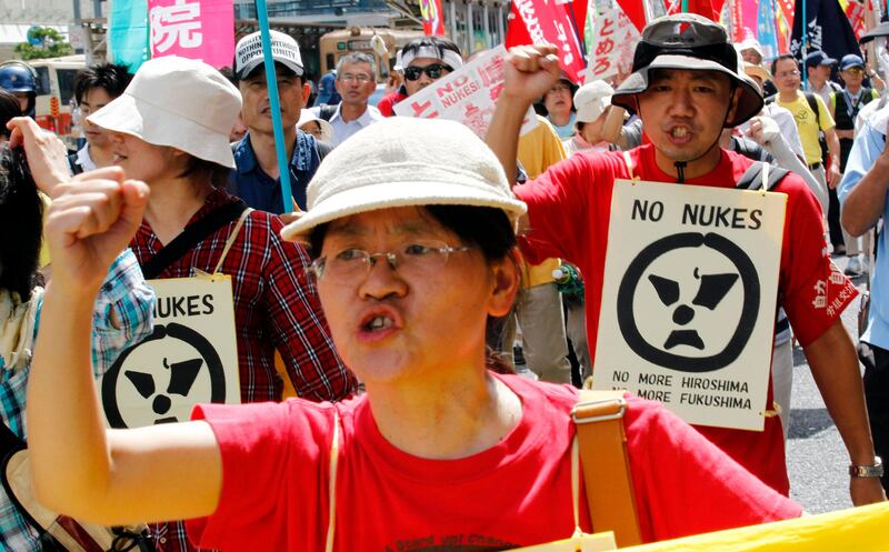 Protesters shout slogans at an anti-nuclear march in Hiroshima August 6, 2011. Prime Minister Naoto Kan vowed on Saturday to challenge the "myth of safety" of nuclear power while marking the 66th anniversary of the atomic bombing of Hiroshima, a city that has now started questioning its long embrace of nuclear energy's peaceful use.  REUTERS/Kim Kyung-Hoon (JAPAN - Tags: CIVIL UNREST POLITICS MILITARY ANNIVERSARY ENERGY) *** Local Caption ***  TOK716_JAPAN-NUCLEA_0806_11.JPG