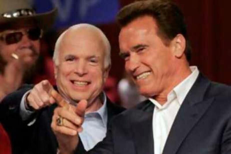 Republican presidential candidate Sen. John McCain, R-Ariz., left, and California Gov. Arnold Schwarzenegger arrive at a rally Friday, Oct. 31, 2008 at the Nationwide Arena in Columbus, Ohio.  (AP Photo/Kiichiro Sato) *** Local Caption ***  OHKS119_APTOPIX_McCain_2008.jpg