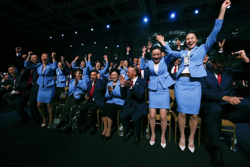 Members of the delegation from Beijing 2022 Winter Olympics candidate city react after the city was elected to host the 2022 Olympic Winter Games. Vincent Thian / AP Photo