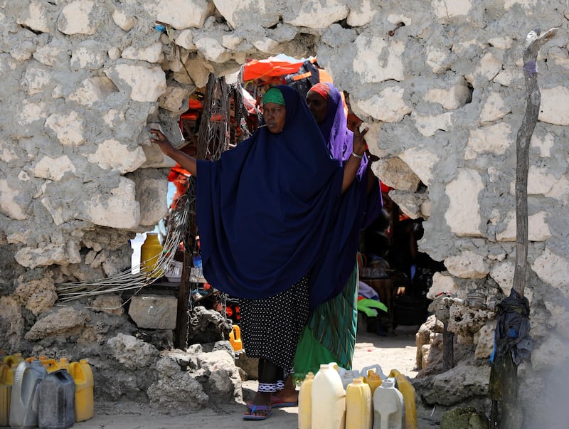 A Somali woman looks out from an opening in a wall on a beach in Mogadishu, Somalia, October 25, 2017. Picture taken October 25, 2017. REUTERS/Marius Bosch