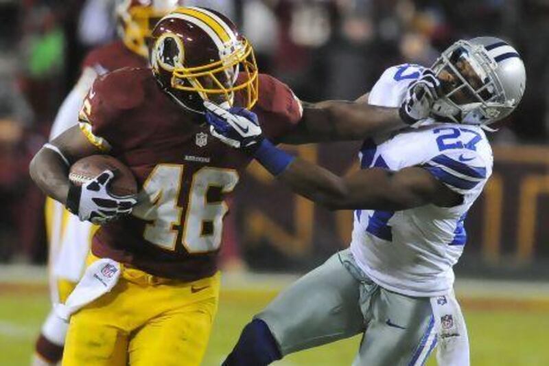 Washington running back Alfred Morris, left, was drafted in the next-to-last round but quickly emerged as the Redskins' top rushing threat.