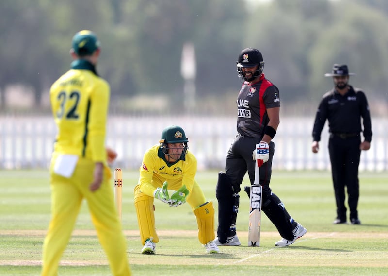 Abu Dhabi, United Arab Emirates - October 22, 2018: Alex Carey of Australia gathers the ball in the match between the UAE and Australia in a T20 international. Monday, October 22nd, 2018 at Zayed cricket stadium oval, Abu Dhabi. Chris Whiteoak / The National