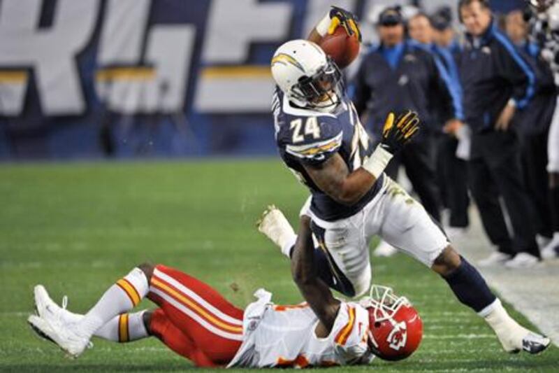 San Diego Chargers' Ryan Mathews is hooked by Kansas City defensive back Javier Arenas