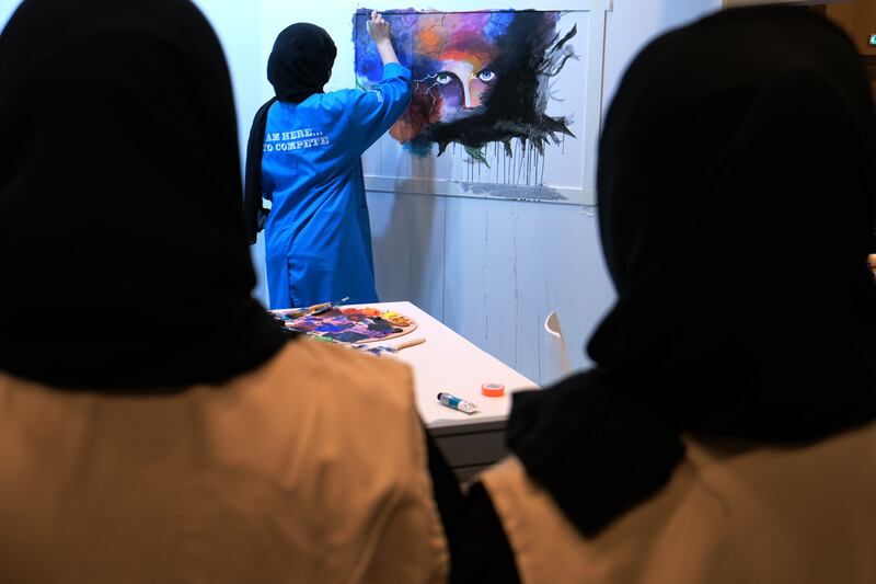 Abrar Alhammadi with her entry in the EmiratesSkills competition’s painting category at Adnec on Tuesday. Delores Johnson / The National
