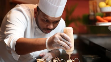 Chef de cuisine Chandika Ratnayaka plates up plant-based taco made at Bounty Beets in the Marina, Dubai. Chris Whiteoak / The National