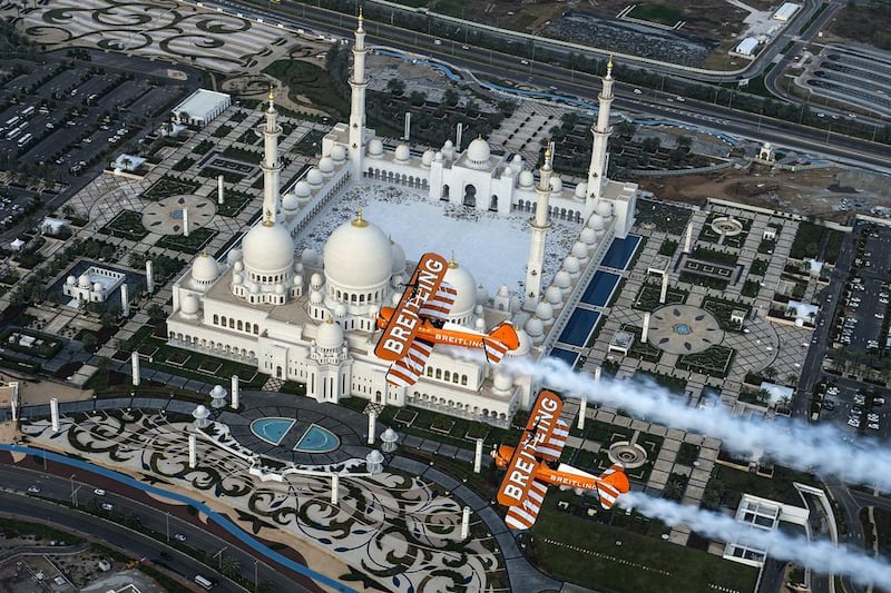 The Breitling Wingwalkers team perform in close formation over the Shaikh Zayed Grand Mosque. Joerg Mitter / Breitling SA via AP Images