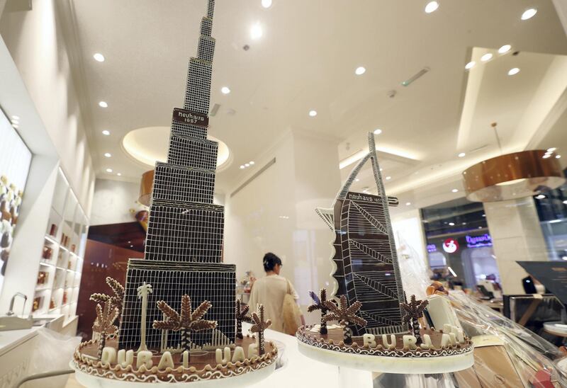 Dubai, United Arab Emirates - July 20, 2019: Standalone. A chocolate Burj Khalifa and a chocolate Burj Al Arab stand on display at Neuhaus Chocolate in Dubai Mall. Saturday the 20th of July 2019. Downtown, Dubai. Chris Whiteoak / The National