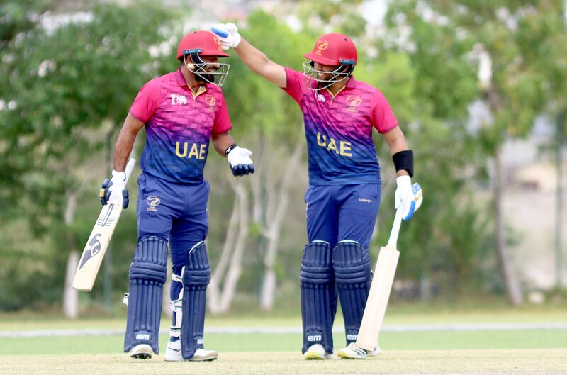 Asif Khan, right, and Alishan Sharafu of UAE during the ACC Men's Premier Cup 2024 Group B match against Kuwait at the Oman Cricket Stadium in Al Amerat, Muscat. All pictures by Subas Humagain for The National
