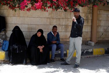 Members of African communities in Yemen gather outside the headquarters of the UN migration agency in Sanaa Yemen, 13 March 2021. EPA