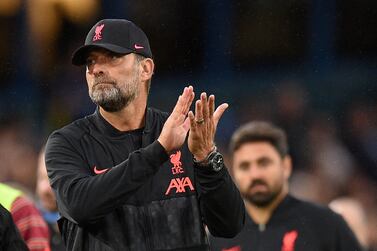 Liverpool's German manager Jurgen Klopp applauds the supporters at the end of the match during the English Premier League football match between Leeds United and Liverpool at Elland Road in Leeds, northern England on September 12, 2021.  (Photo by Oli SCARFF / AFP) / RESTRICTED TO EDITORIAL USE.  No use with unauthorized audio, video, data, fixture lists, club/league logos or 'live' services.  Online in-match use limited to 120 images.  An additional 40 images may be used in extra time.  No video emulation.  Social media in-match use limited to 120 images.  An additional 40 images may be used in extra time.  No use in betting publications, games or single club/league/player publications.   /  