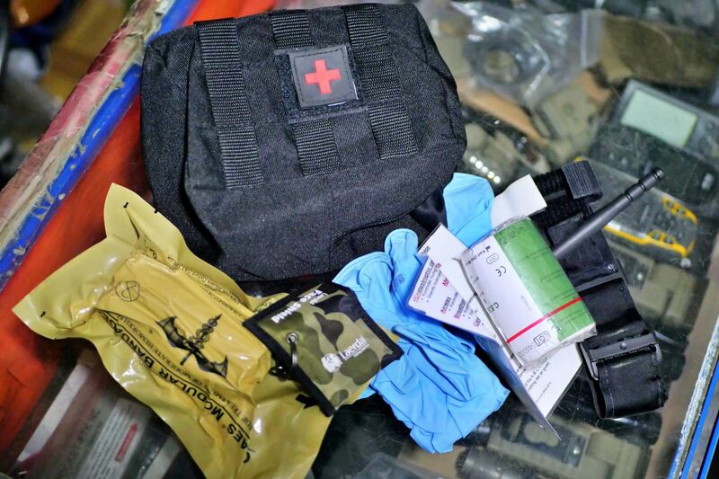 Pictured: The contents of an individual first aid kit sold at Mustafa's shop in central Kabul, including a tournique and a hemostatic dressing used to stop arterial bleeding.
Photo by Charlie Faulkner