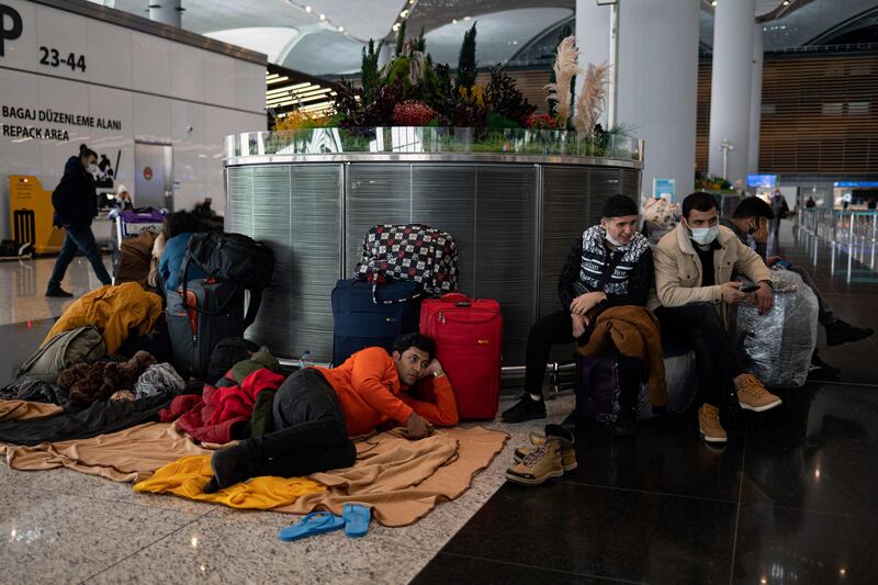 Stranded passengers wait at Istanbul Airport. AFP