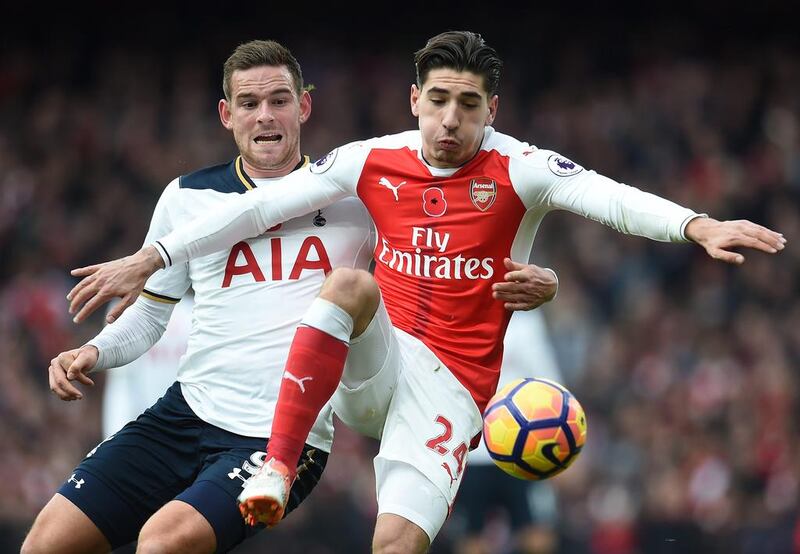 Arsenal’s Hector Bellerin vies for the ball with Tottenham’s Vincent Janssen. Andy Rain / EPA
