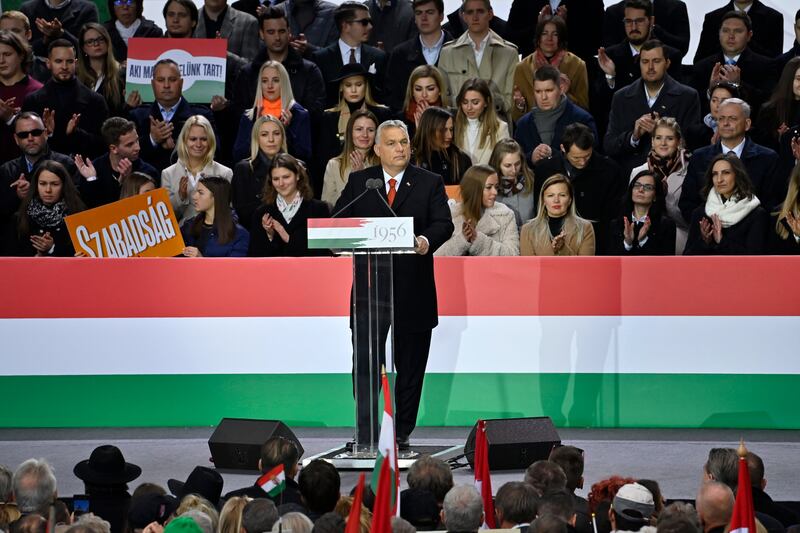 Hungarian Prime Minister Viktor Orban addresses a crowd at a rally marking 65 years since an anti-Soviet uprising in Communist-era Hungary. EPA