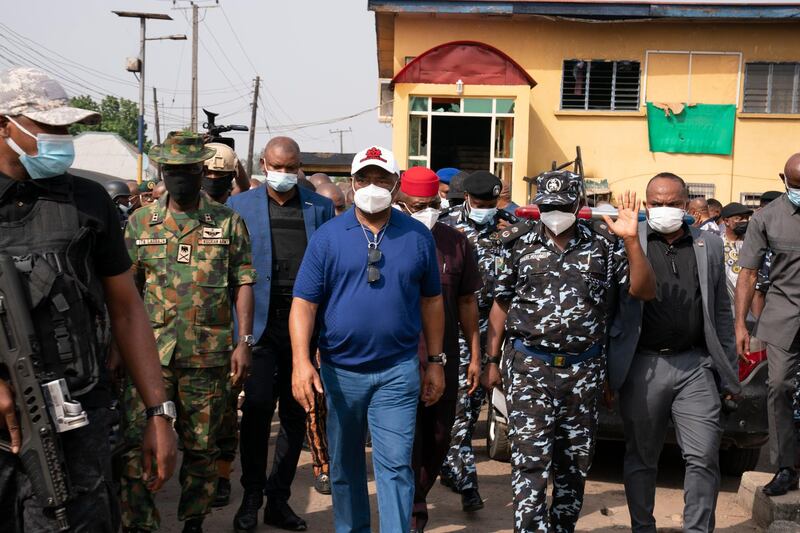 Imo state Gov. Hope Uzodinma, center, inspects the scene of an attack at the police command headquarters in Owerri. AP Photo