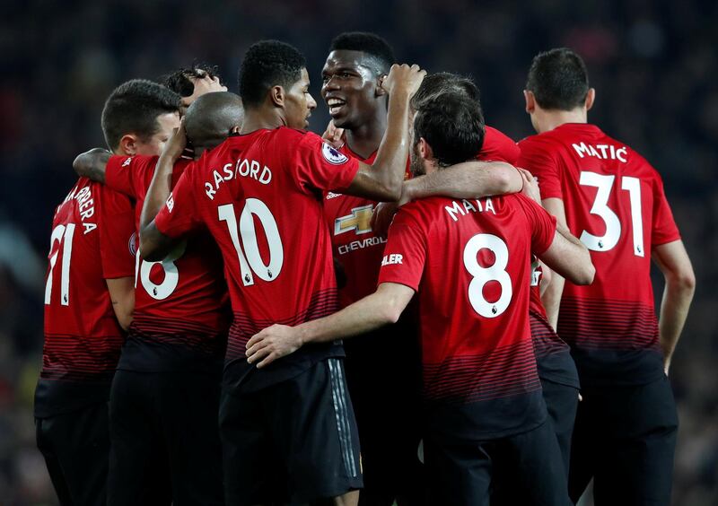 Manchester United's Paul Pogba celebrates scoring their third goal with teammates. Reuters