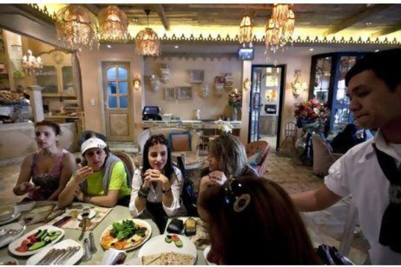 Diners at Shakespeare & Co in Abu Dhabi; there will be many more restaurants in the capital in a few years, a new report says.