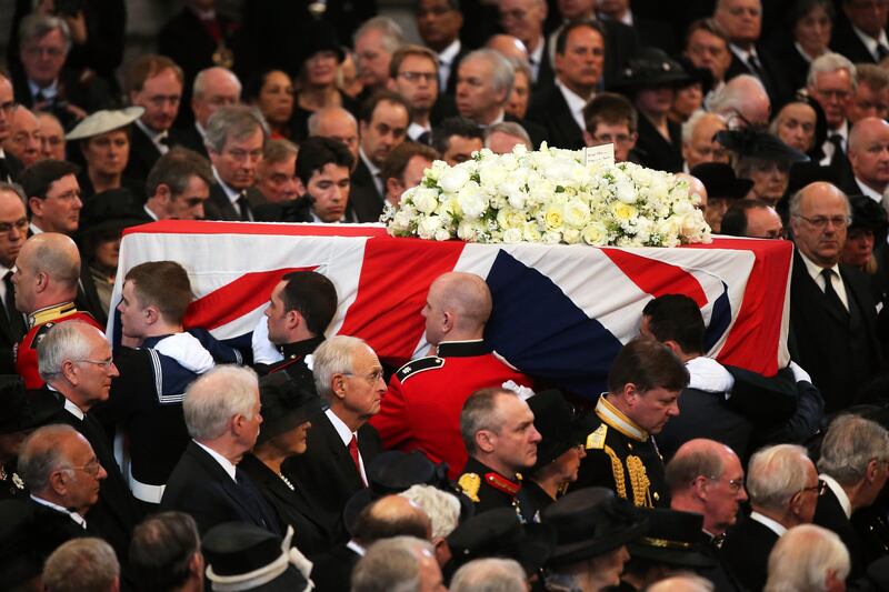 LONDON, ENGLAND - APRIL 17:  Members of the Armed Services carry the coffin  after the Ceremonial funeral of former British Prime Minister Baroness Thatcher at St Paul's Cathedral on April 17, 2013 in London, England. Dignitaries from around the world today join Queen Elizabeth II and Prince Philip, Duke of Edinburgh as the United Kingdom pays tribute to former Prime Minister Baroness Thatcher during a Ceremonial funeral with military honours at St Paul's Cathedral. Lady Thatcher, who died last week, was the first British female Prime Minister and served from 1979 to 1990.  (Photo by Christopher Furlong/Getty Images) *** Local Caption ***  166798214.jpg