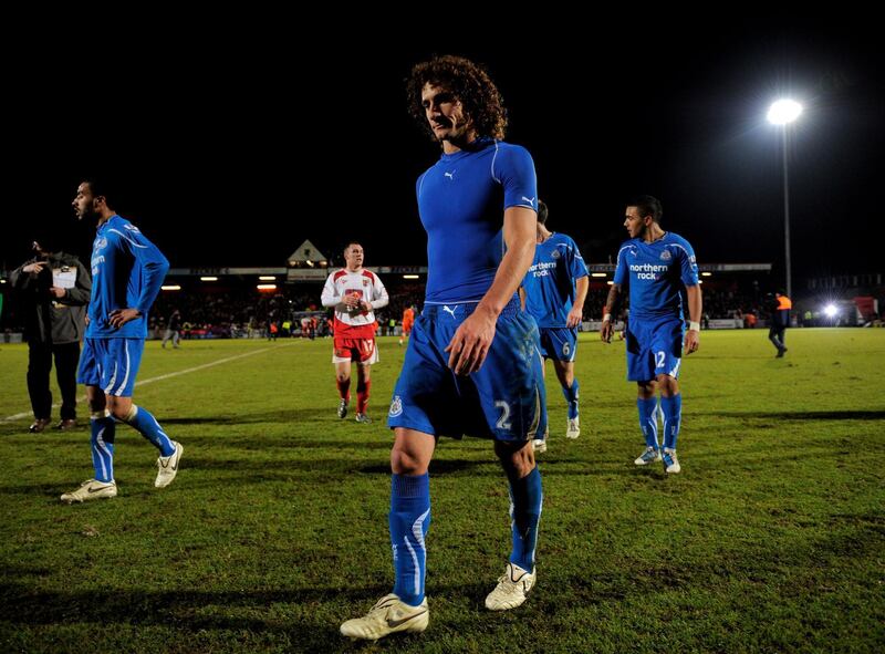 STEVENAGE, ENGLAND - JANUARY 08:  A dejected Fabricio Colloccini of Newcastle walks off the pitch following his team's 3-1 defeat during the FA Cup sponsored by E.ON 3rd round match between Stevenage and Newcastle United at the Lamex Stadium on January 8, 2011 in Stevenage, England.  (Photo by Michael Regan/Getty Images)