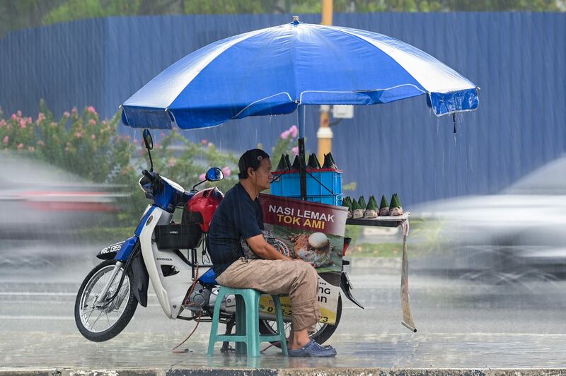 A vendor sells the popular Malay dish nasi lemak in Kuala Lumpur. AFP