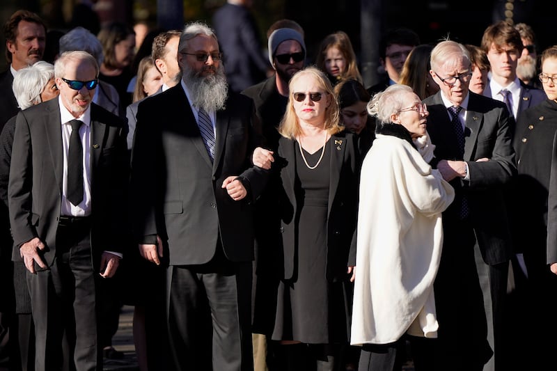 Members of the Carter family watch as the casket arrives at the Jimmy Carter Presidential Library and Museum. EPA