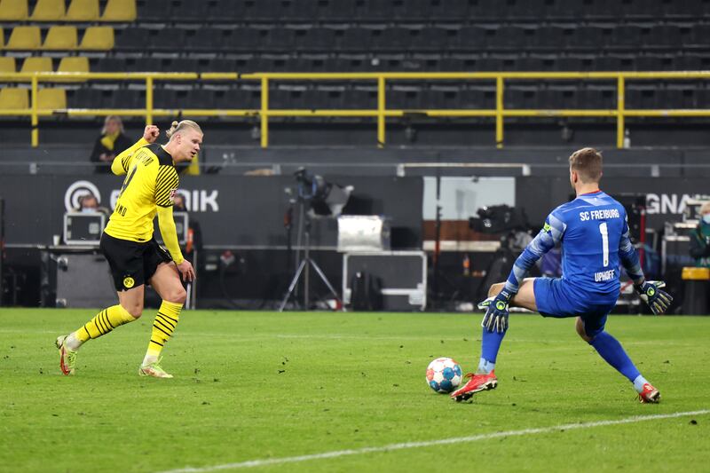 Erling Haaland scores for Dortmund in the Bundesliga match against Freiburg in January, 2022. Getty