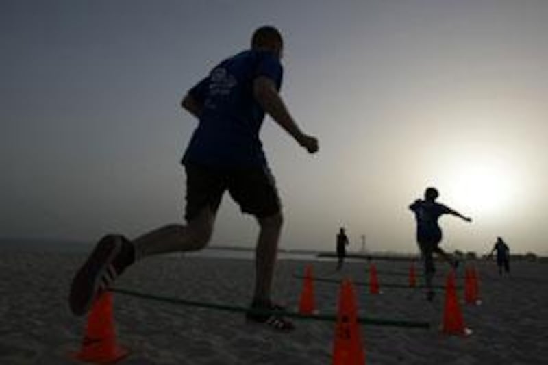 A military-style training camp at the public beach in Abu Dhabi.