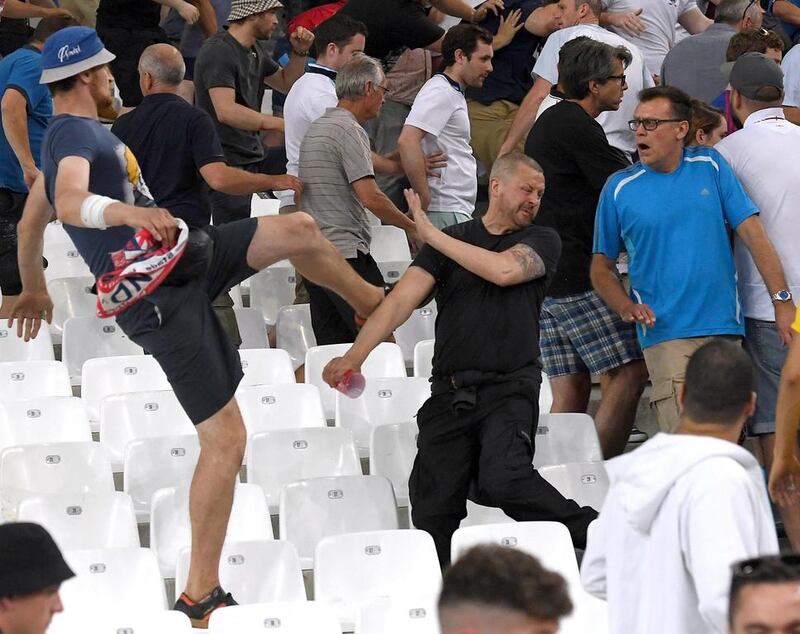 Supporters clash in the stands after the UEFA EURO 2016 group B preliminary round match between England and Russia at Stade Velodrome in Marseille, France. Daniel Dal Zennaro / EPA