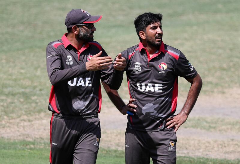 Dubai, United Arab Emirates - October 14, 2019: The UAE's Junaid Siddique (R) with capt Ahmed Raza during the ICC Mens T20 World cup qualifier warm up game between the UAE and Scotland. Monday the 14th of October 2019. International Cricket Stadium, Dubai. Chris Whiteoak / The National