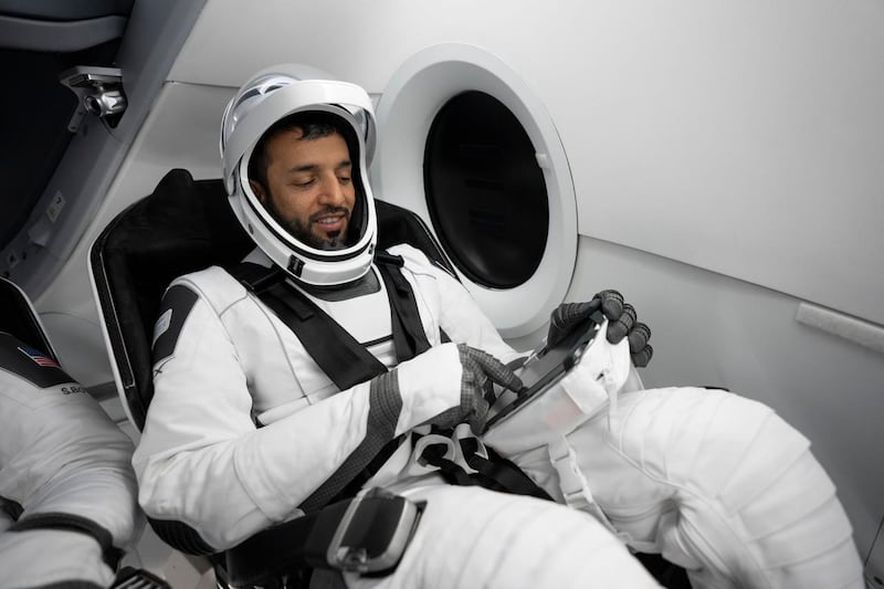 Dr Al Neyadi trains inside a SpaceX Dragon capsule.