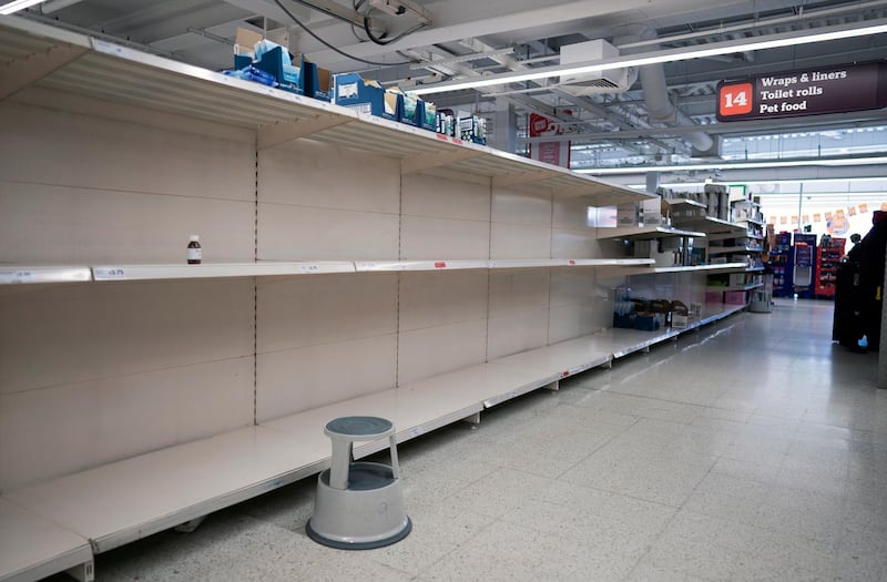 A general view of an almost empty aisle in a Sainsbury's supermarket in Central London, 06 March 2020. Reports suggest UK retailers are suffering supply disruptions because of conoravirus. Will Oliver / EPA