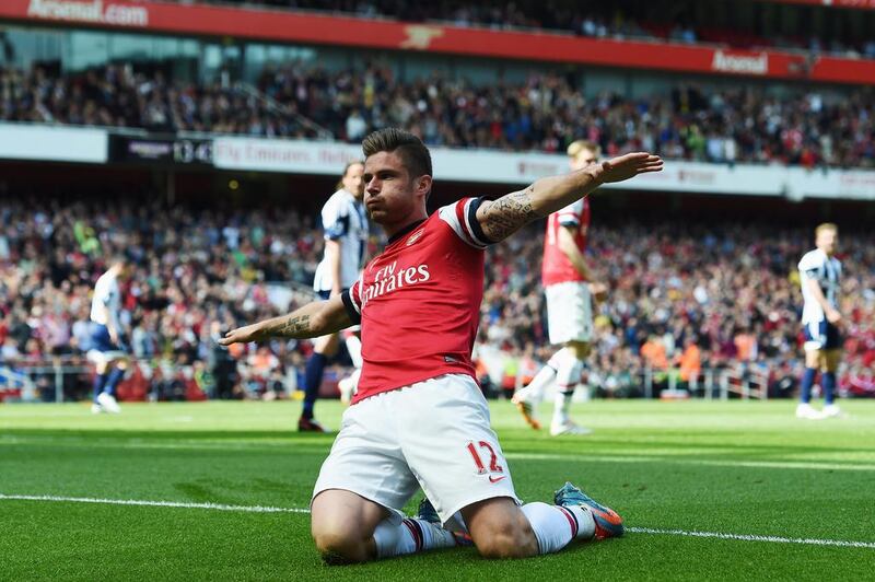 Olivier Giroud of Arsenal celebrates after scoring during the Premier League match against West Bromwich Albion at the Emirates Stadium on May 4, 2014.  Shaun Botterill / Getty Images