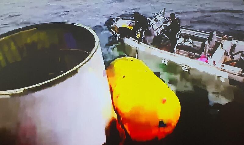 This handout photo taken on May 31, 2023 and provided by South Korean Defence Ministry in Seoul shows an object presumed to be part of North Korea's claimed 'Space Launch Vehicle' being salvaged by South Korea's miliaty in waters 200km (124 miles) west of Eocheong Island in the Yellow Sea.  South Korea's military said on May 31, it had located and was salvaging a suspected part of a North Korean spy satellite that crashed into the sea shortly after launch due to a rocket failure.  (Photo by Handout  /  South Korean Defence Ministry  /  AFP)  /  RESTRICTED TO EDITORIAL USE - MANDATORY CREDIT "AFP PHOTO  /  South Korean Defence Ministry" - NO MARKETING NO ADVERTISING CAMPAIGNS - DISTRIBUTED AS A SERVICE TO CLIENTS