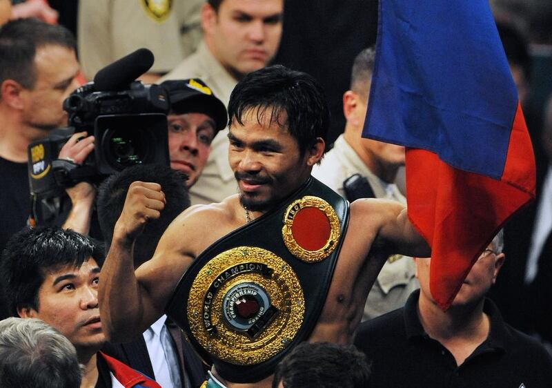 Manny Pacquiao held titles in eight weight divisions in his career. Mark Ralston / AFP 