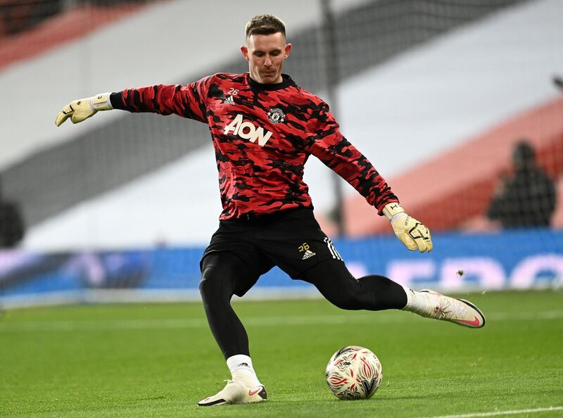 MANCHESTER, ENGLAND - FEBRUARY 09: Dean Henderson of Manchester United warms up prior to The Emirates FA Cup Fifth Round match between Manchester United and West Ham United at Old Trafford on February 09, 2021 in Manchester, England. Sporting stadiums around the UK remain under strict restrictions due to the Coronavirus Pandemic as Government social distancing laws prohibit fans inside venues resulting in games being played behind closed doors. (Photo by Michael Regan/Getty Images)