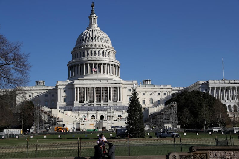 Construction for the upcoming presidential inauguration ceremony is seen outside of the U.S. Capitol Building in Washington, U.S., December 28, 2020. REUTERS/Leah Millis