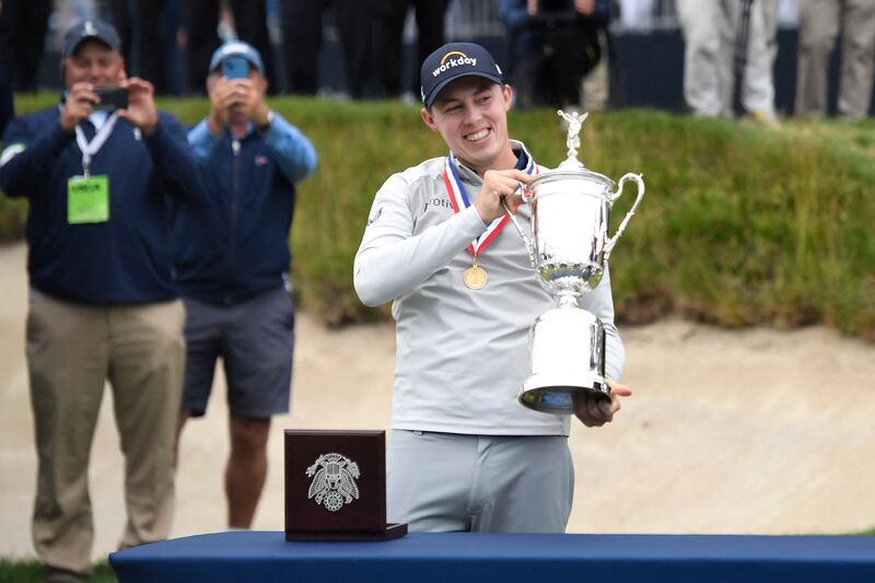 Matt Fitzpatrick holds the championship trophy after winning the 2022 US Open at Brookline, Massachusetts, USA. Reuters